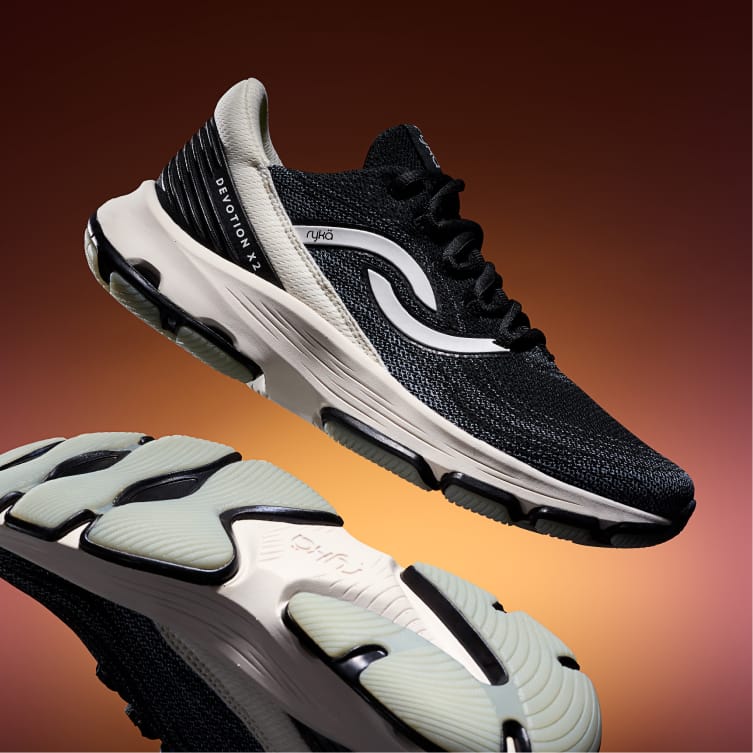 Black and white sneaker on orange gradient background