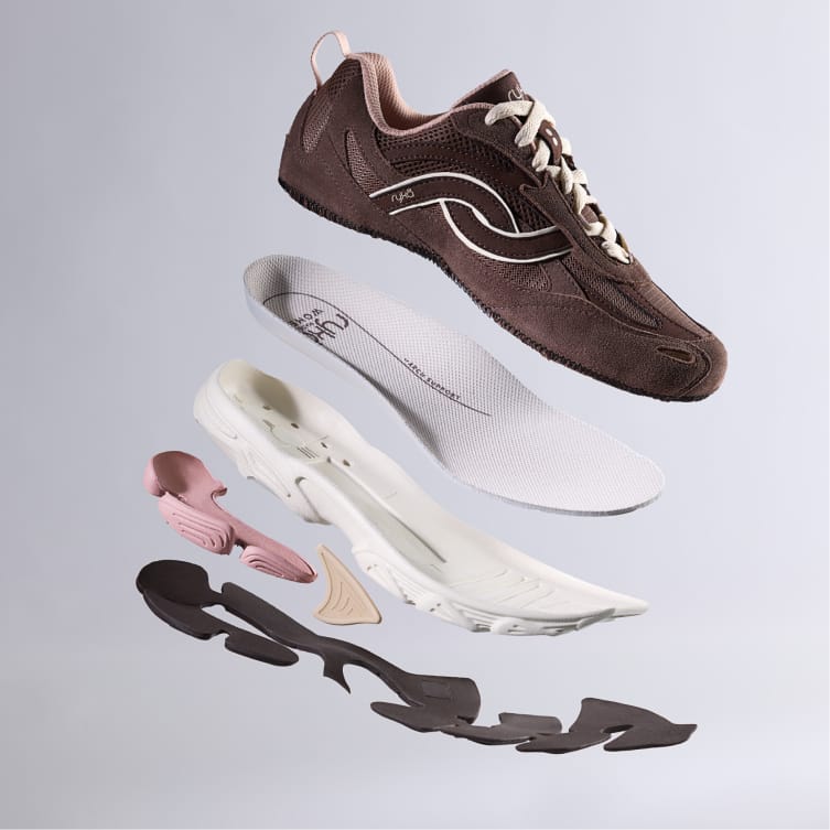 Brown sneaker separated into parts including the upper, insole, and sole. 