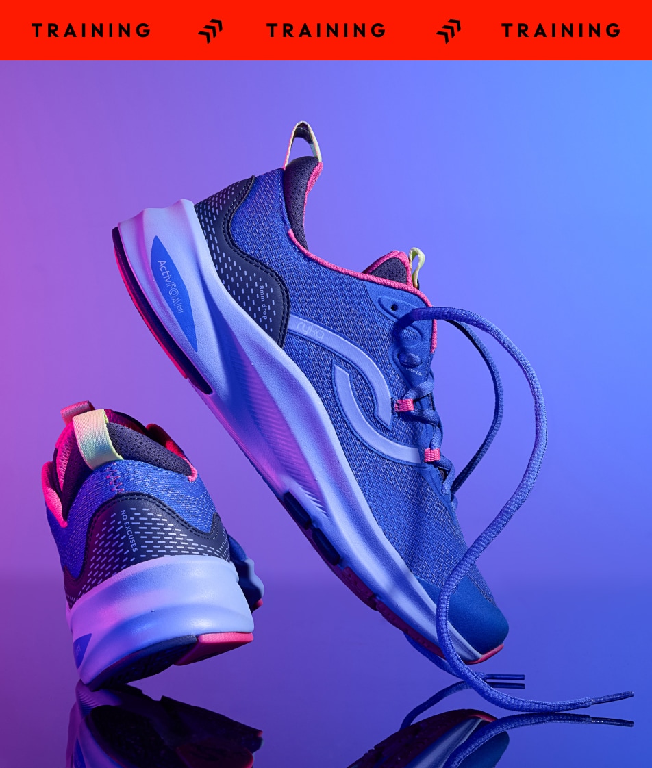A pair of blue women's training sneakers on a purple and blue gradient background. A red banner at the top says 