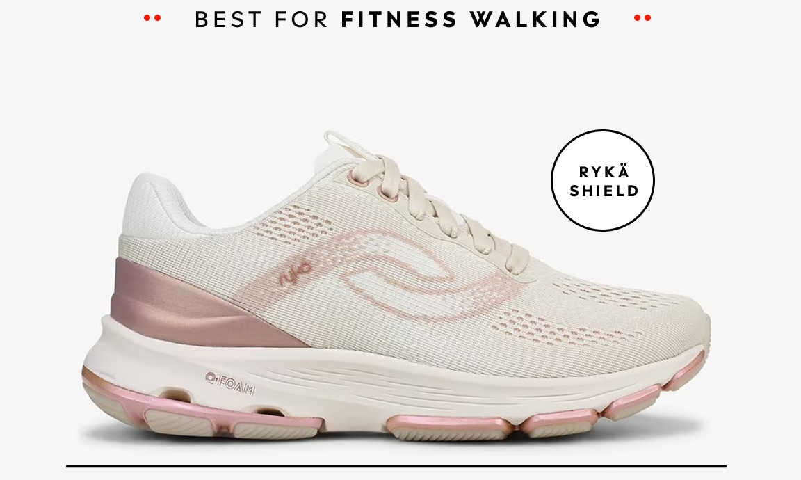 A side view of a beige women's walking sneaker with pink metallic details. Text around the shoe reads 