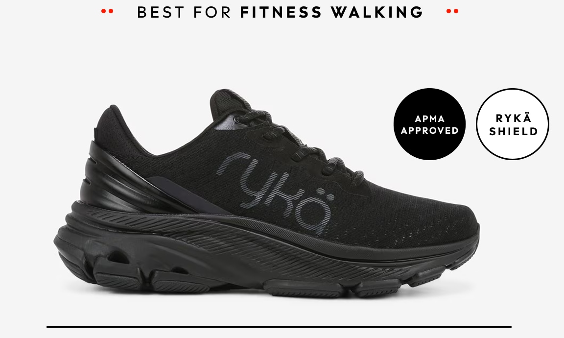A side view of an all-black women's walking sneaker. Text around the shoe reads 