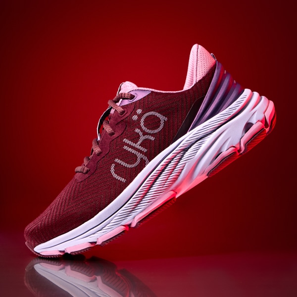a red Rykä shoe on a red background