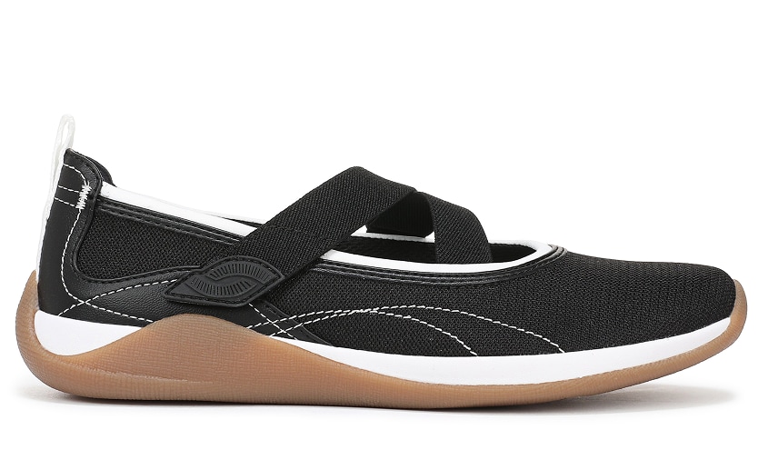 A side view of a black and white Mary Jane sneaker with a gum sole.