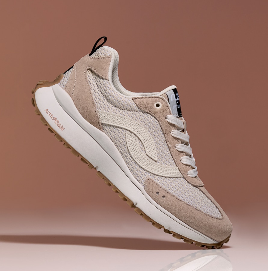 sideview of a Ryka neutral colored sneaker