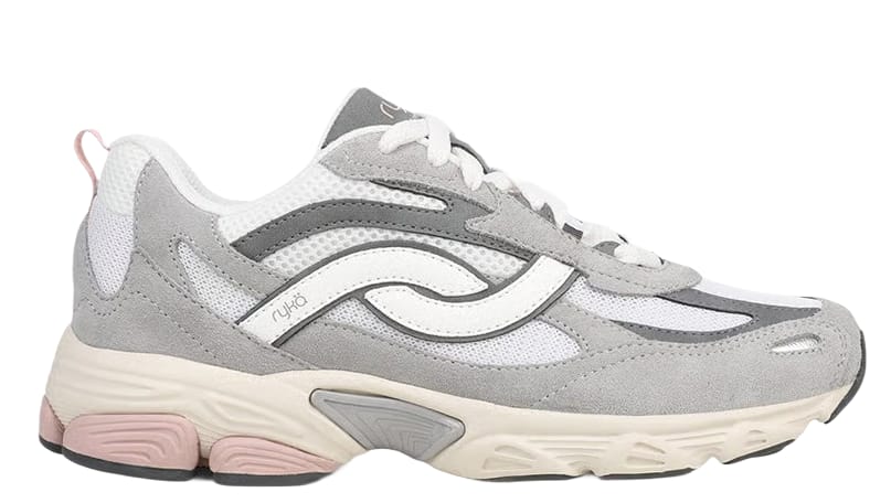 Side view of a women's gray sneaker with suede panels, pink accents, and a chunky sole. 