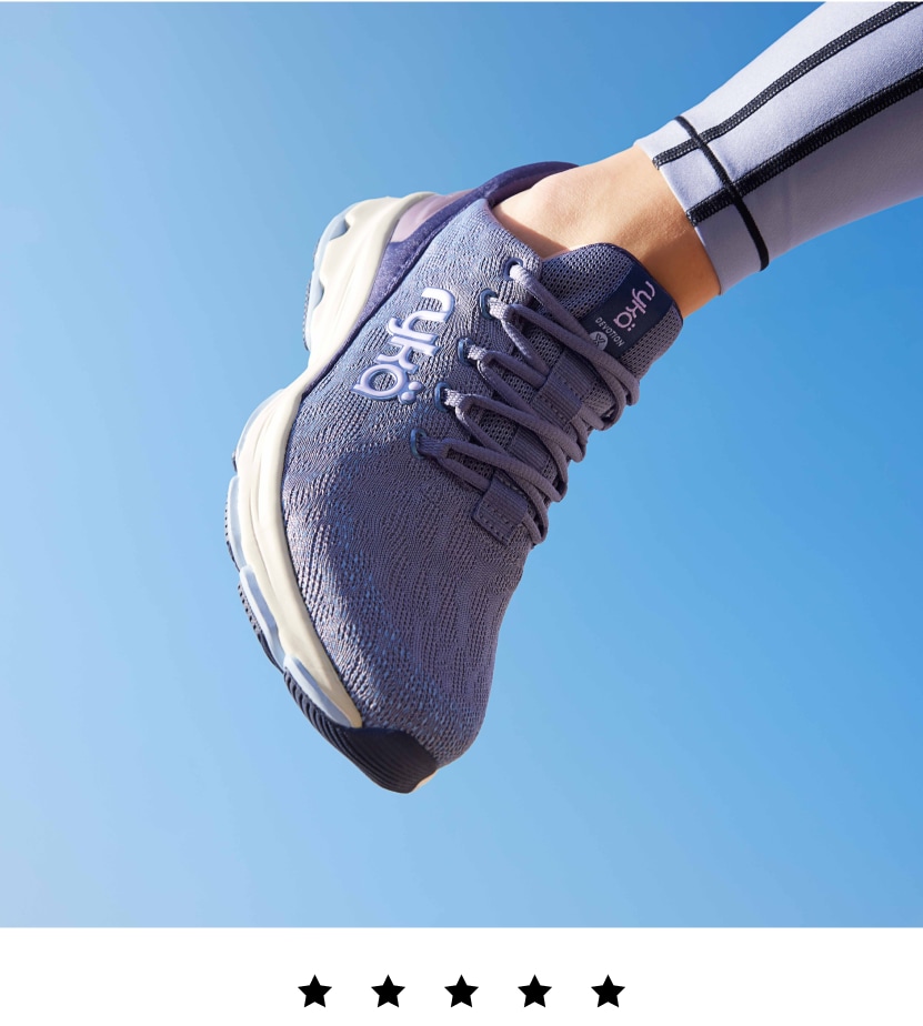 A model wearing a blue Rykä Devotion X shoe