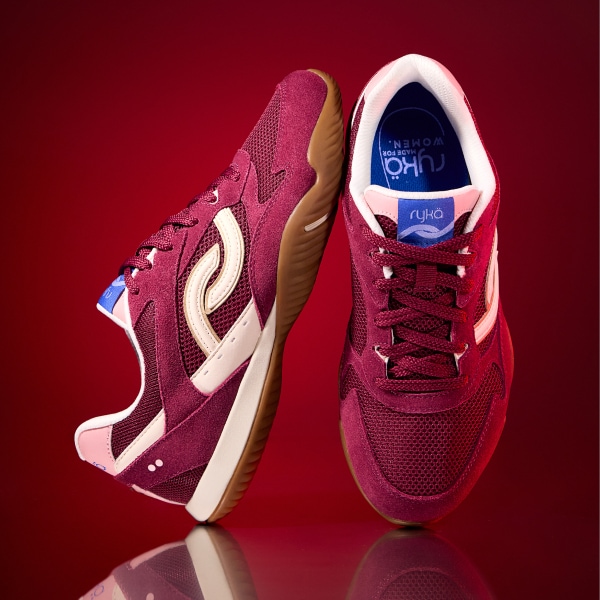 A pair of red Rykä Candor shoes on a red background